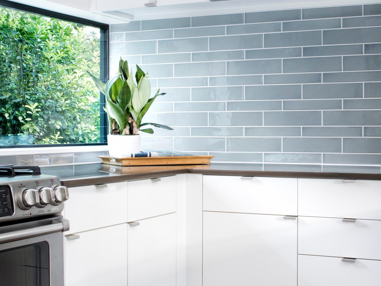 Blue Gray Glass Tile Backsplash Adds Color To Sleek Modern Kitchen